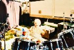 1. Rick (6yrs) testing out the Radiators drum kit with young Mitch (3yrs) beside him checking kit is all in order. He road crews for them too these days.